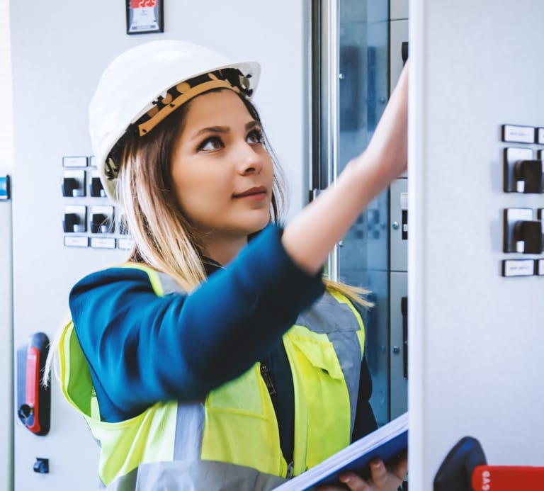 Women wearing high vis and hard hat