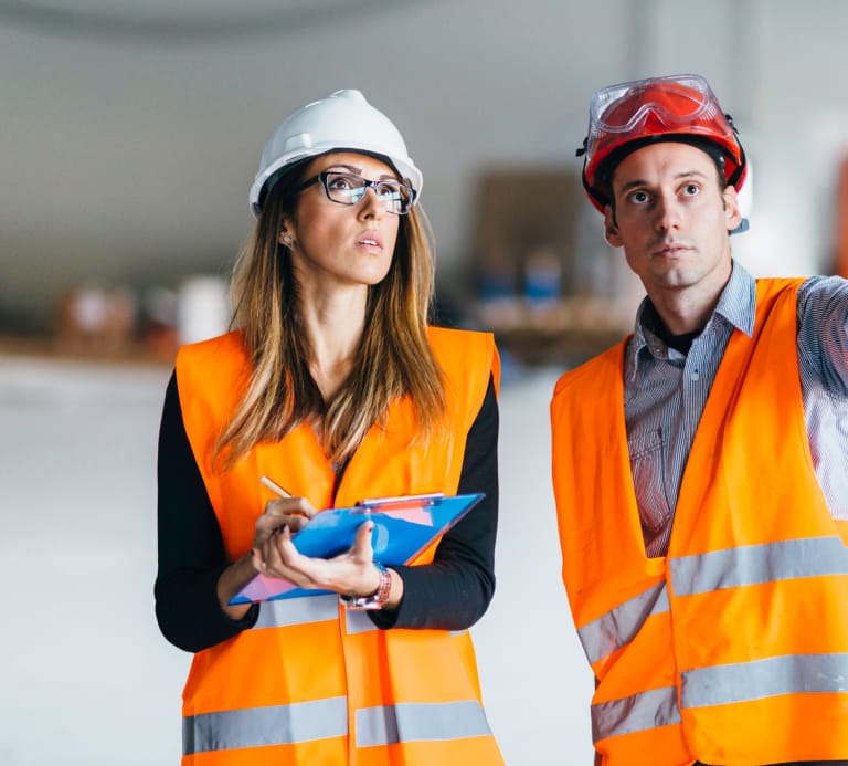 Women wearing high vis, goggles and hard hat
