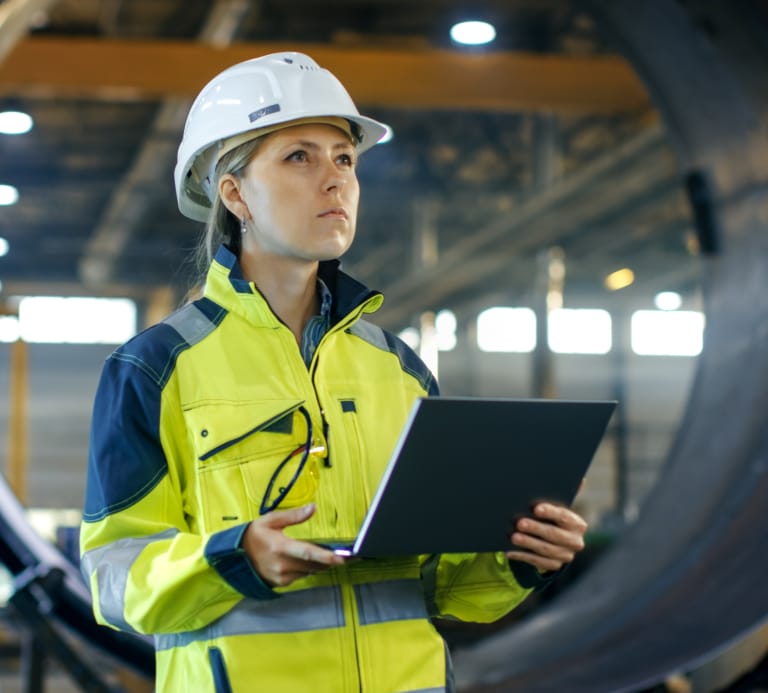 Women wearing high vis and hard hat